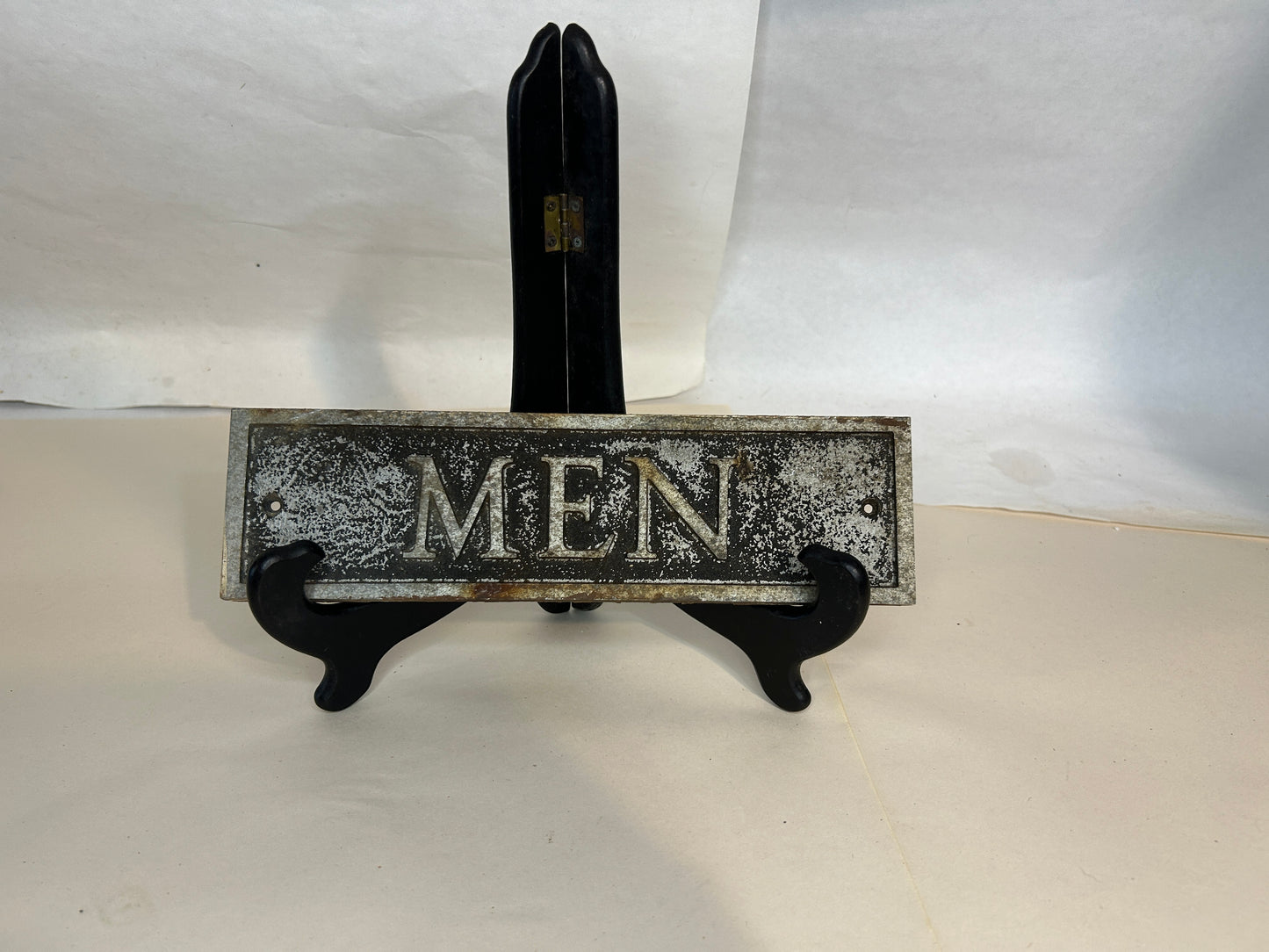 Vintage Cast Iron “MEN” Sign Hangs Flush to the Wall